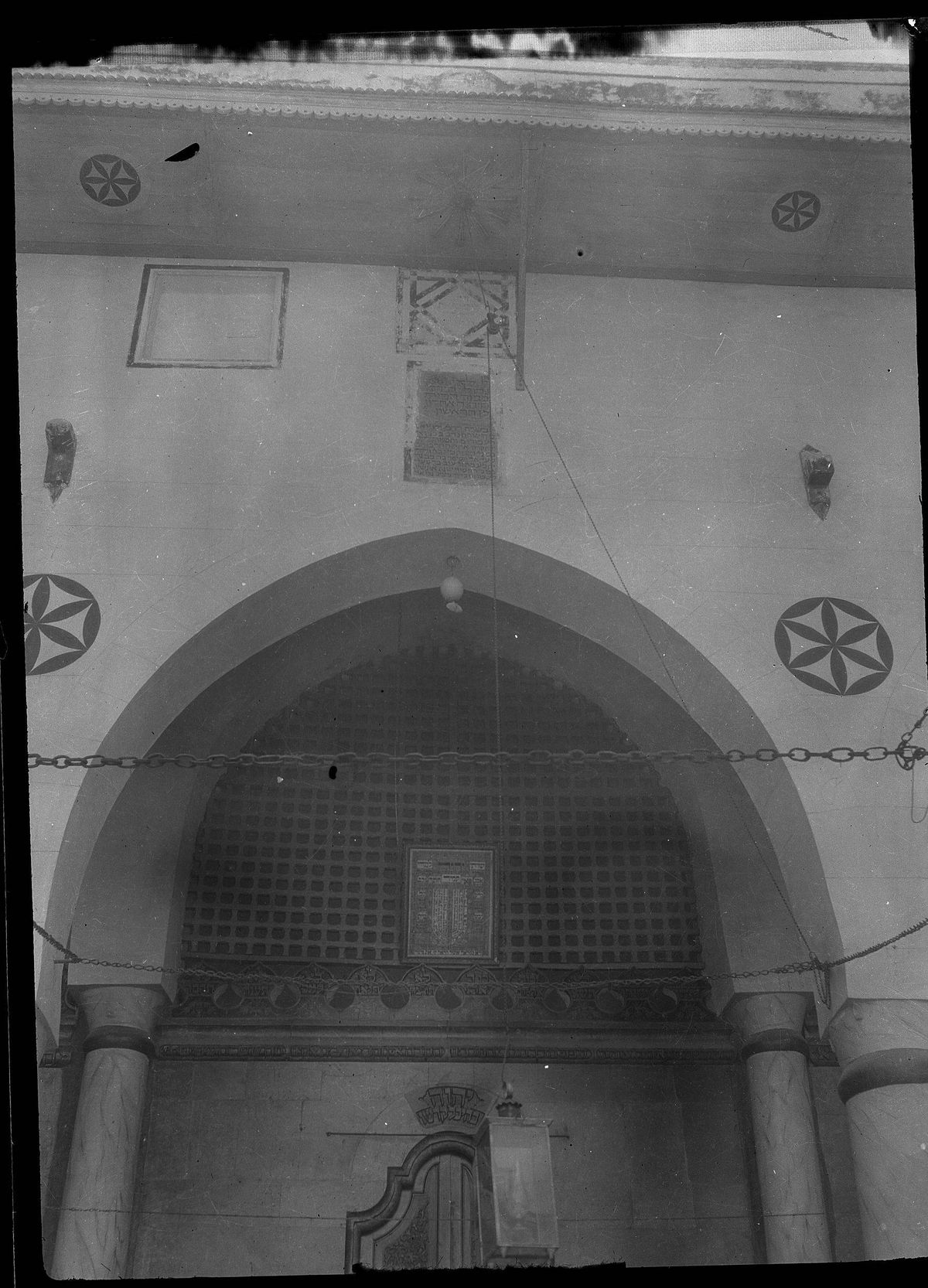 Arched stone ark of the Great Synagogue of Aleppo with carved six-pointed rosettes
